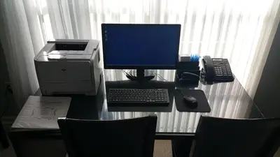 a desk with a computer and a printer on it at The Village at Pocono in Blakeslee