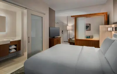 a bedroom with a white bed and a television at SpringHill Suites by Marriott Mount Laurel in Mount Laurel