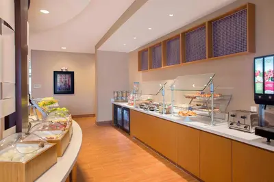 a restaurant with a buffet line with food on display at SpringHill Suites by Marriott Mount Laurel in Mount Laurel