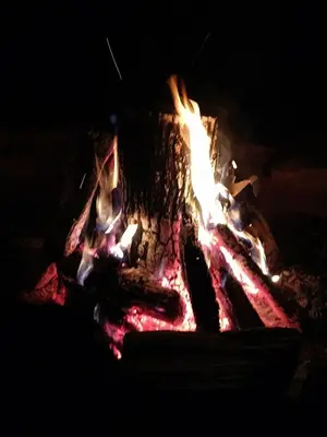a fire pit in the dark with flames at Apple Bin Inn in Willow Street