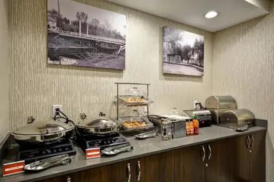a kitchen with a counter with pots and pans at TownePlace Suites by Marriott Cranbury South Brunswick in Cranbury