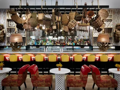a bar with chairs and a counter with a bar at The Whitby Hotel in New York