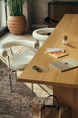 a wooden table with a chair and a laptop on it at Park Terrace Hotel in New York