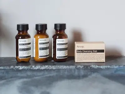 three bottles of honey sitting next to a box at Wm. Mulherin's Sons Hotel in Philadelphia
