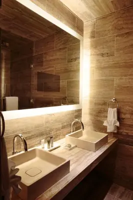 a bathroom with a sink and a mirror at Lexington Plaza Hotel in New York