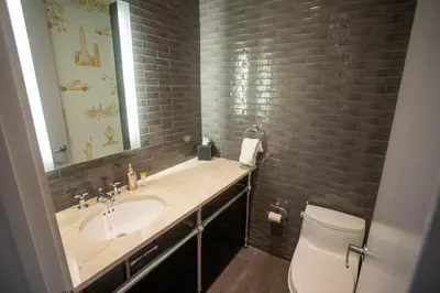 a bathroom with a sink and a toilet at Lexington Plaza Hotel in New York