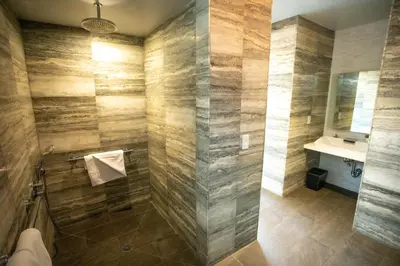 a bathroom with a sink and a shower at Lexington Plaza Hotel in New York