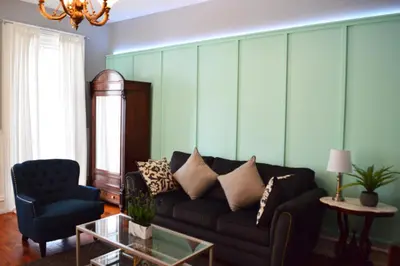 a living room with a couch and a chair at Mountain View Suites in Jim Thorpe