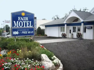 a sign for a fair motel in front of a building at Fair Motel in Upper Saddle River
