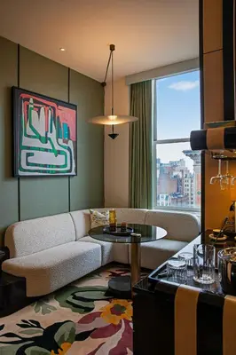 a living room with a couch and a table at W New York - Union Square in New York
