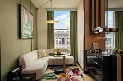 a living room with a couch and a table at W New York - Union Square in New York