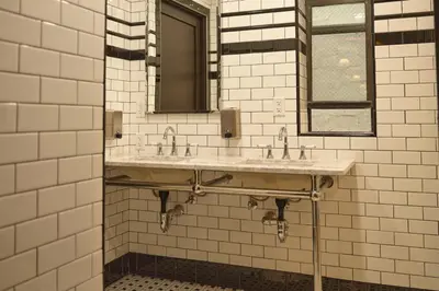 a bathroom with two sinks and a mirror at West Village Eurohostel in New York