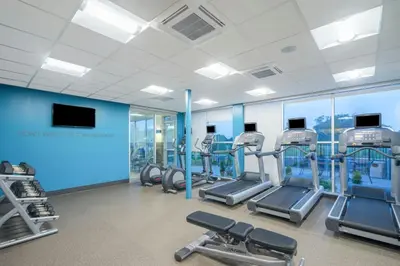 a gym with treadmills and cardio equipment in a building at Fairfield Inn & Suites by Marriott Bloomsburg in Bloomsburg