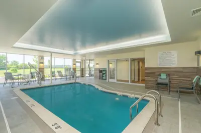 a large swimming pool in a hotel room at Fairfield Inn & Suites by Marriott Bloomsburg in Bloomsburg