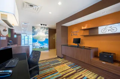 an office with a desk and a computer on a wall at Fairfield Inn & Suites by Marriott Bloomsburg in Bloomsburg