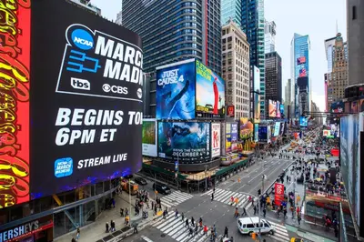 a busy street in a city with people and buildings at Renaissance New York Times Square by Marriott in New York