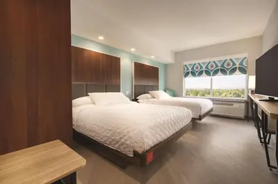 a hotel room with two beds and a window at Tru By Hilton Lancaster East in Lancaster