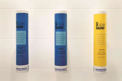 three blue yellow and white deodorants on a shelf at Tru By Hilton Lancaster East in Lancaster