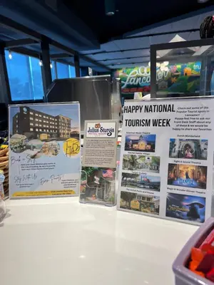 a display of signs on a table in a store at Tru By Hilton Lancaster East in Lancaster