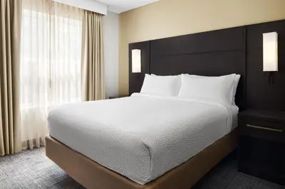 a bedroom with a large bed and a window at Residence Inn by Marriott Harrisburg Carlisle in Carlisle