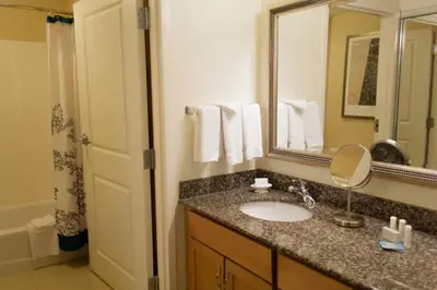 a bathroom with a sink and a mirror at Residence Inn by Marriott Harrisburg Carlisle in Carlisle