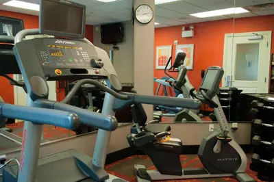 a gym with two tread machines and a tv at Residence Inn by Marriott Harrisburg Carlisle in Carlisle