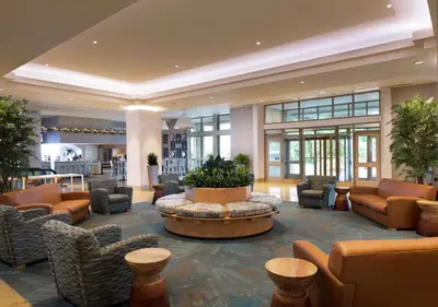 a lobby with couches and a table in a building at Hilton Philadelphia at Penn's Landing in Philadelphia