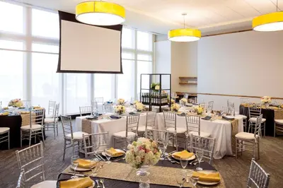 a conference room with tables and chairs and a projection screen at Hilton Philadelphia at Penn's Landing in Philadelphia