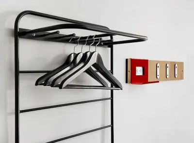a metal rack with utensils hanging on a wall at Pod Times Square in New York