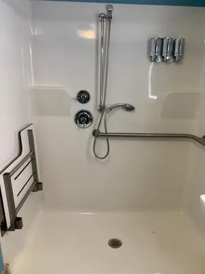 a shower stall in a bathroom with a shower at Waterfront Inn PHL Airport in Essington