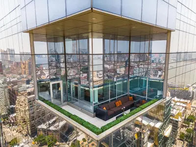 an aerial view of a building with a pool at The Dominick Hotel in New York