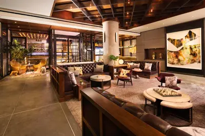 a lobby of a hotel with couches and tables at Kimpton Hotel Eventi by IHG in New York