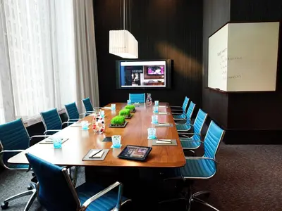 a large conference room with a long table and chairs at Kimpton Hotel Eventi by IHG in New York