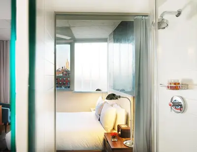 a bedroom with a bed and a window at Nolitan Hotel SoHo - New York in New York