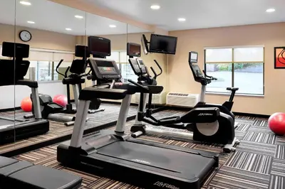 a fitness room with treadmills and elliptical machines at TownePlace Suites by Marriott Harrisburg Hershey in Harrisburg