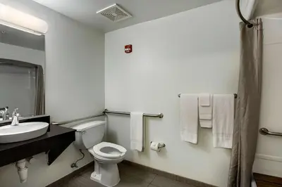 a bathroom with a white toilet and a sink at Studio 6-East Brunswick, NJ - NYC Area in East Brunswick