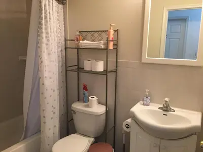 a bathroom with a toilet and a sink at Mojoy Homesuites At Runyon in Newark