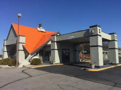 a building with an orange roof on a street at America's Best Value Inn Phillipsburg in Phillipsburg