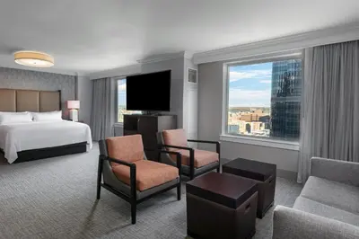 a hotel room with a bed and a large window at Philadelphia Marriott Downtown in Philadelphia