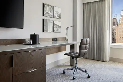 a hotel room with a desk and a chair at Philadelphia Marriott Downtown in Philadelphia