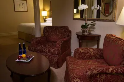 a hotel room with a chair and a table at Fitzpatrick Grand Central in New York