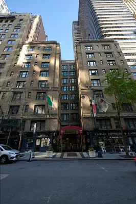 two tall buildings on a street in a city at Fitzpatrick Grand Central in New York