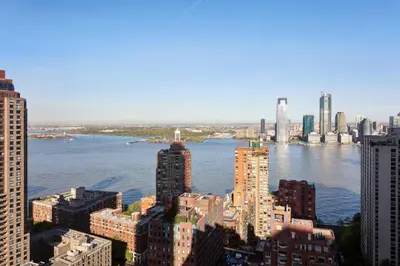 an aerial view of a city with buildings and water at New York Marriott Downtown in New York