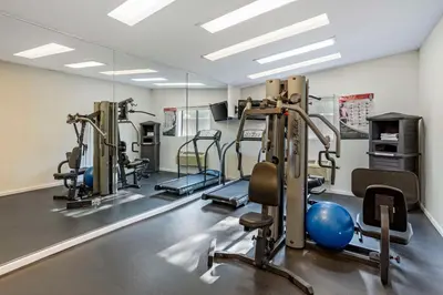 a gym with treadmills and elliptical machines at Best Western Monticello in Monticello