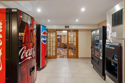 a room with two cocacola soda machines in a store at Best Western Monticello in Monticello