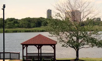 a gazebo next to a tree next to a river at Red Roof Inn PLUS+ Secaucus - Meadowlands in Secaucus
