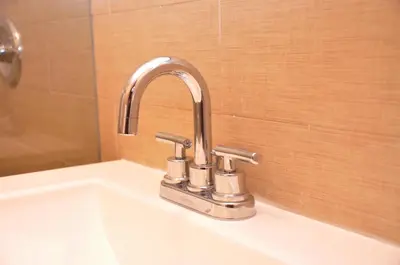 a bathroom sink with a chrome bathroom faucet at Hotel Five44 in New York
