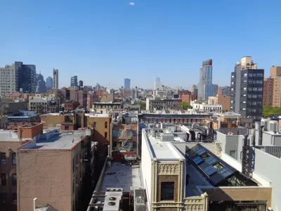 a view of the city from the roof of a building at Redford Hotel in New York