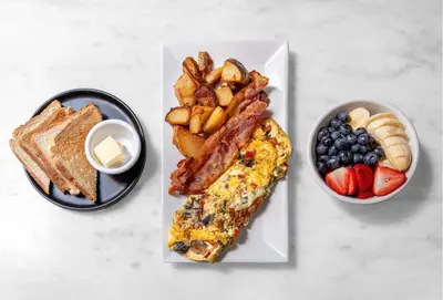 a plate of breakfast foods with toast and fruit at Holiday Inn New York City - Wall Street by IHG in New York