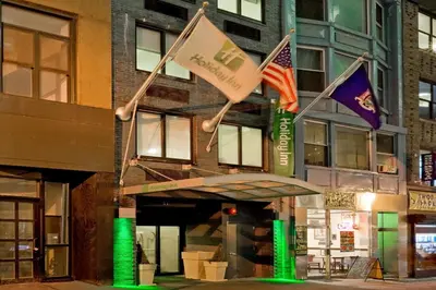 a building with flags in front of it at Holiday Inn New York City - Wall Street by IHG in New York